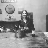 Emma Doody behind a wine bar