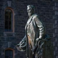 Statue of Ezra Cornell on the Arts Quad