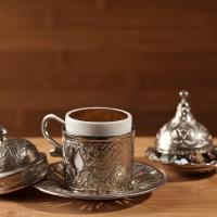 traditional Turkish coffee mug in ornate silver coffee set