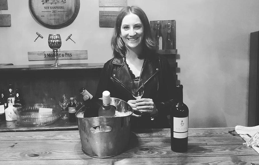 Emma Doody behind a wine bar