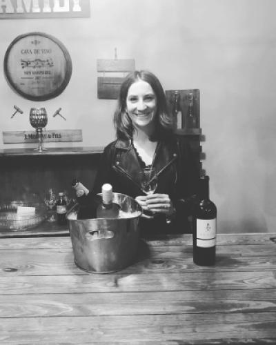 Emma Doody behind a wine bar