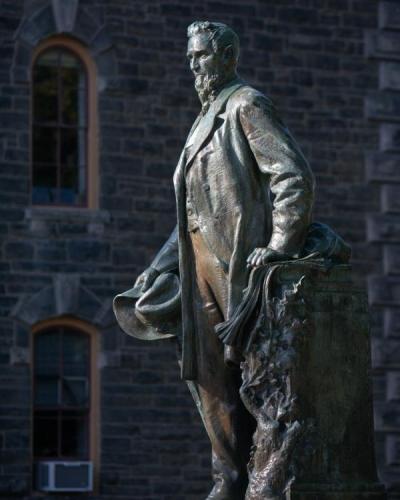 Statue of Ezra Cornell on the Arts Quad